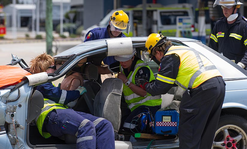 Queensland Ambulance Service training scenario QUT paramedic students training with fire fighters and paramedics.