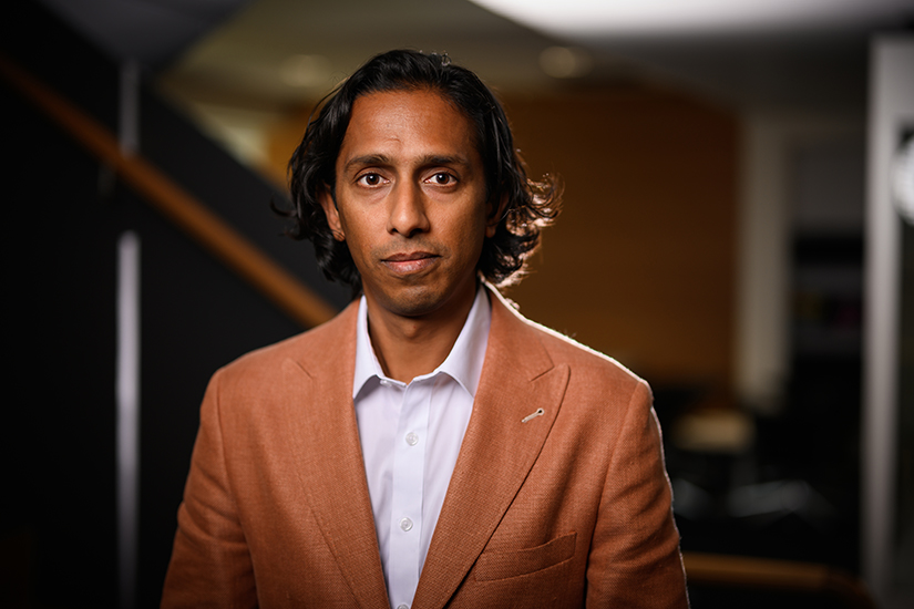 Gaj Panagoda standing in QUT's Executive Education Centre.