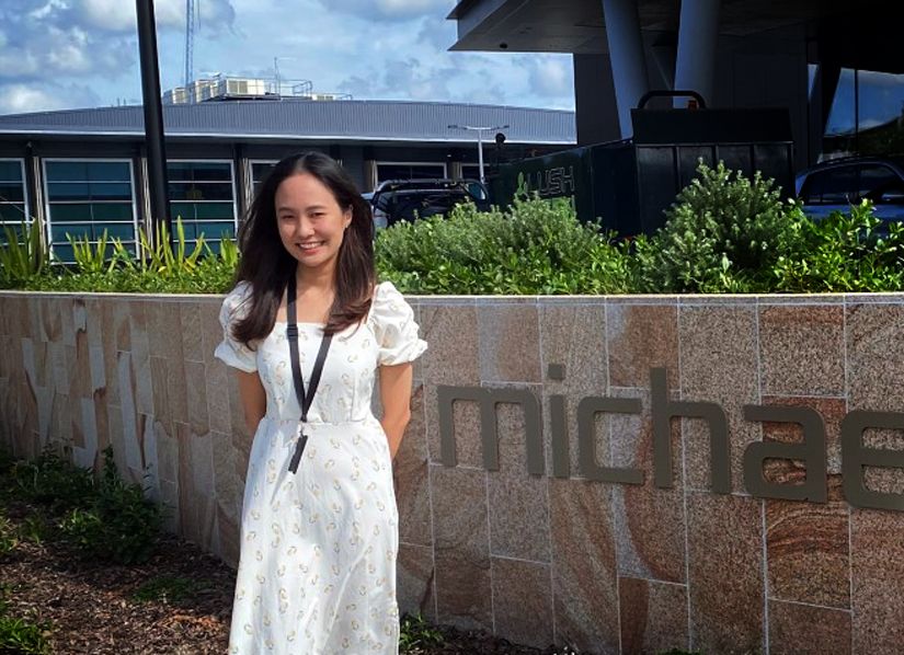 Business and IT student Ray Chel Goh standing outside the Michel Hill Jeweller head office