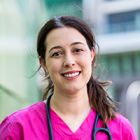 A woman in pink scrubs.