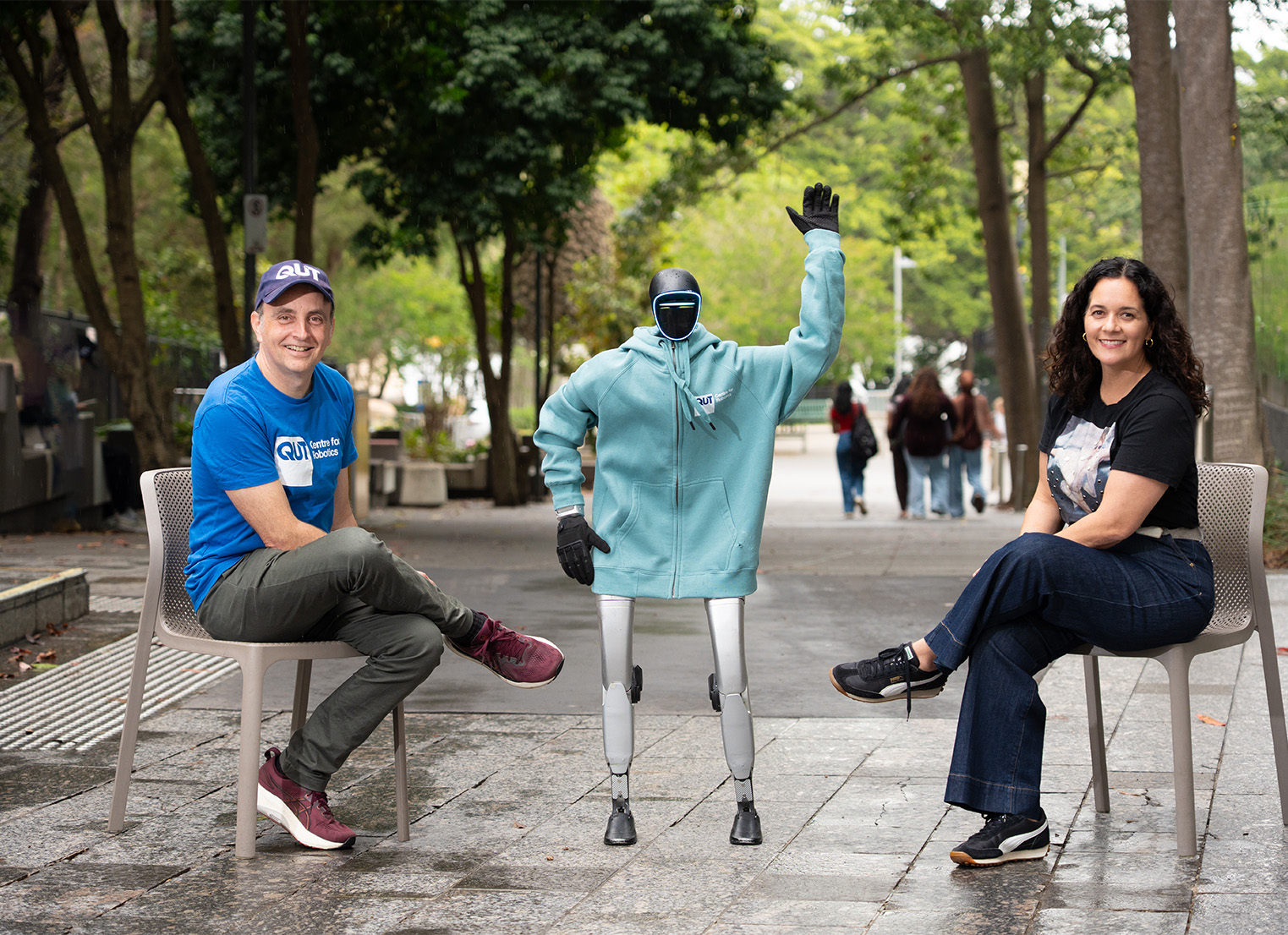 Professor Jonathan Roberts and Professor Glenda Caldwell with QUTie, a QUT humanoid robot.