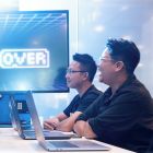 Lincoln and Anh working at a computer