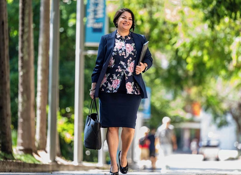 Michelle Brikc walking on QUT campus