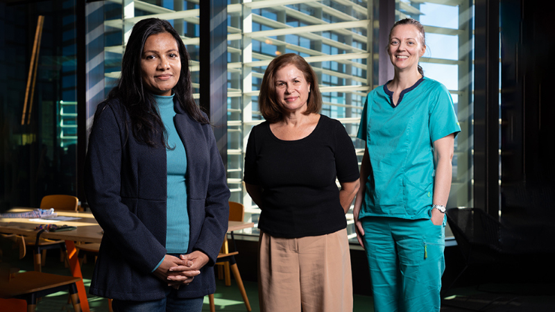QUT researchers stand together.