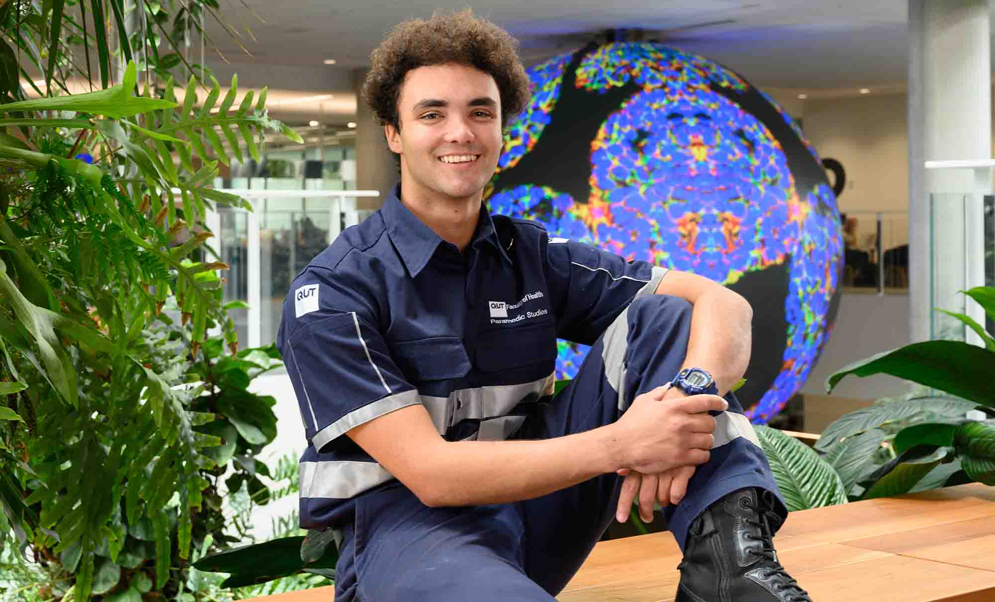 A paramedic science student wears a specialist uniform with pockets, clips and boots.