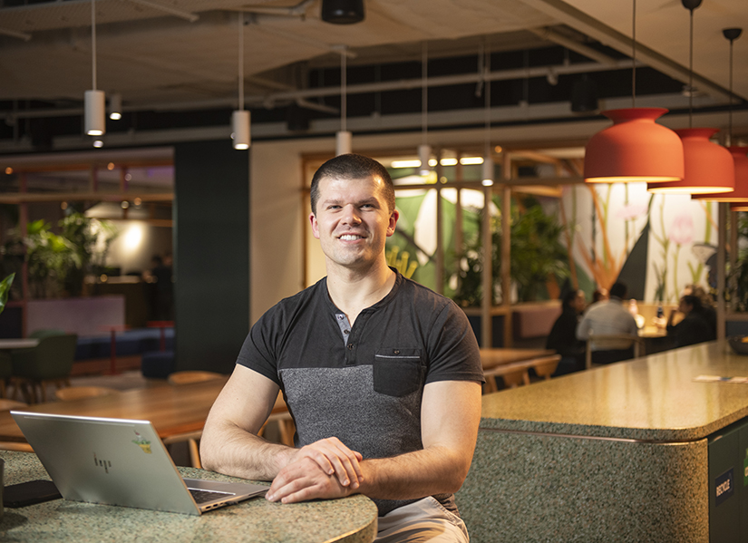 Eddie sitting in the Amazon offices with his laptop