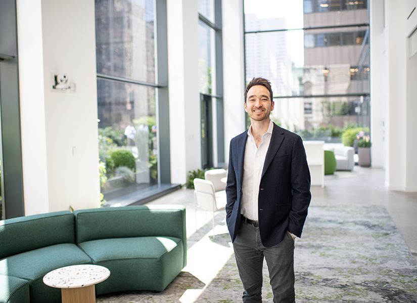 Jesse Lock standing in his New York City offices