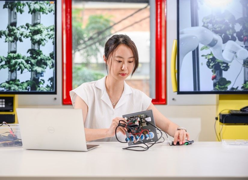 Gina working with electrical components