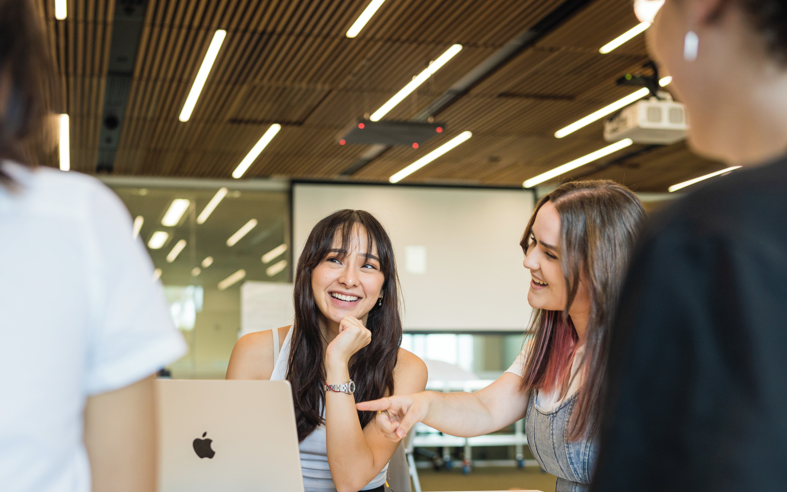 Two female students looking at laptop