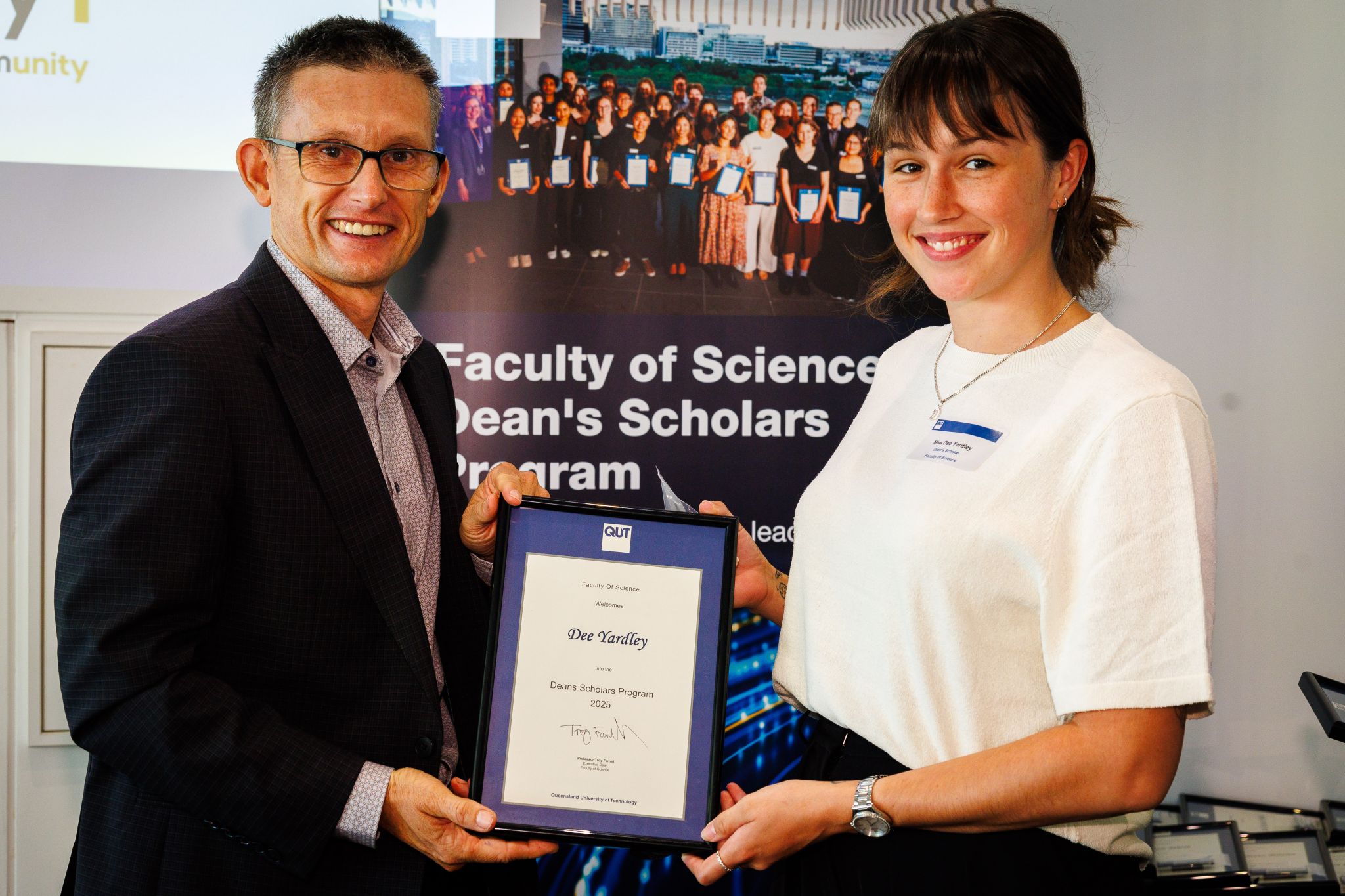 Dee Yardley winning Dean's Scholars Award from Troy Farrell