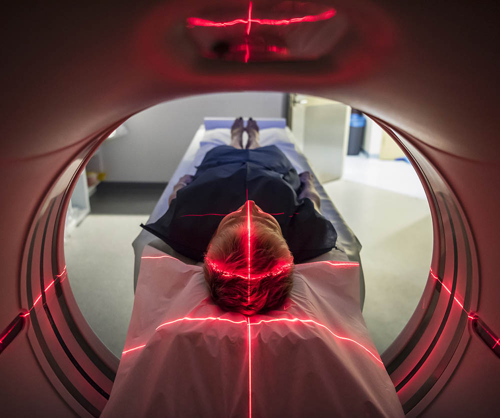 A patient lies still while undertaking an medical resonance imaging (MRI) scan.