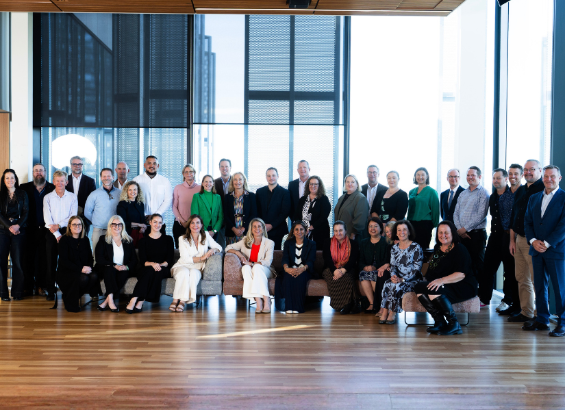 QUT staff stand together to celebrate the Launch of the QUT Leadership Institute.