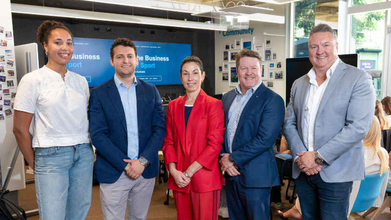 International university students and QUT staff stand together.