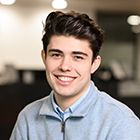 QUT student Lucas Ferreira smiling towards the camera