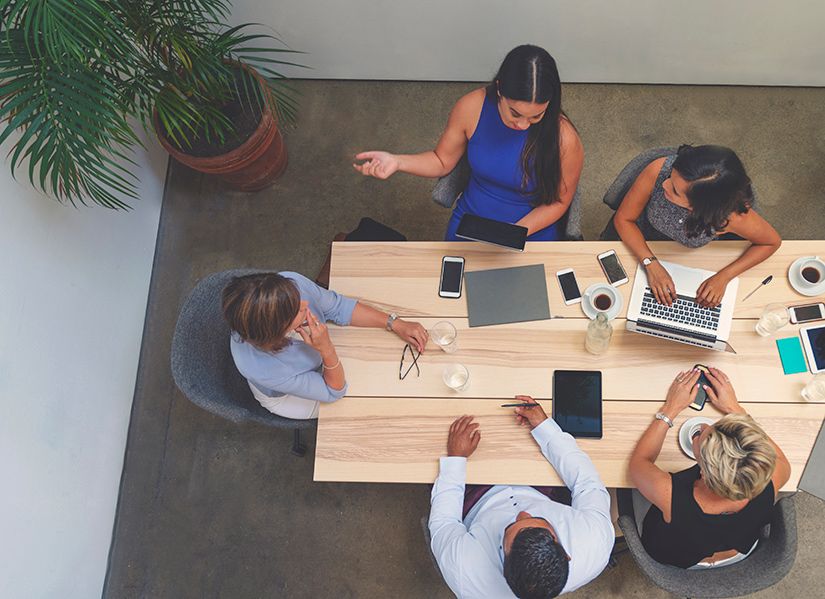 employees sitting around a table