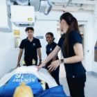 Shruty and Dexter practise with a medical imaging dummy