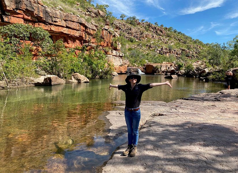 Gen standing next to a creek at Bullo River Station in the Northern Territory