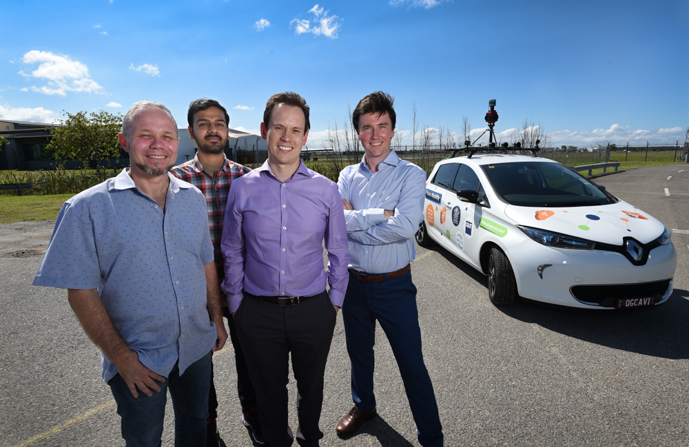 researchers with AI car
