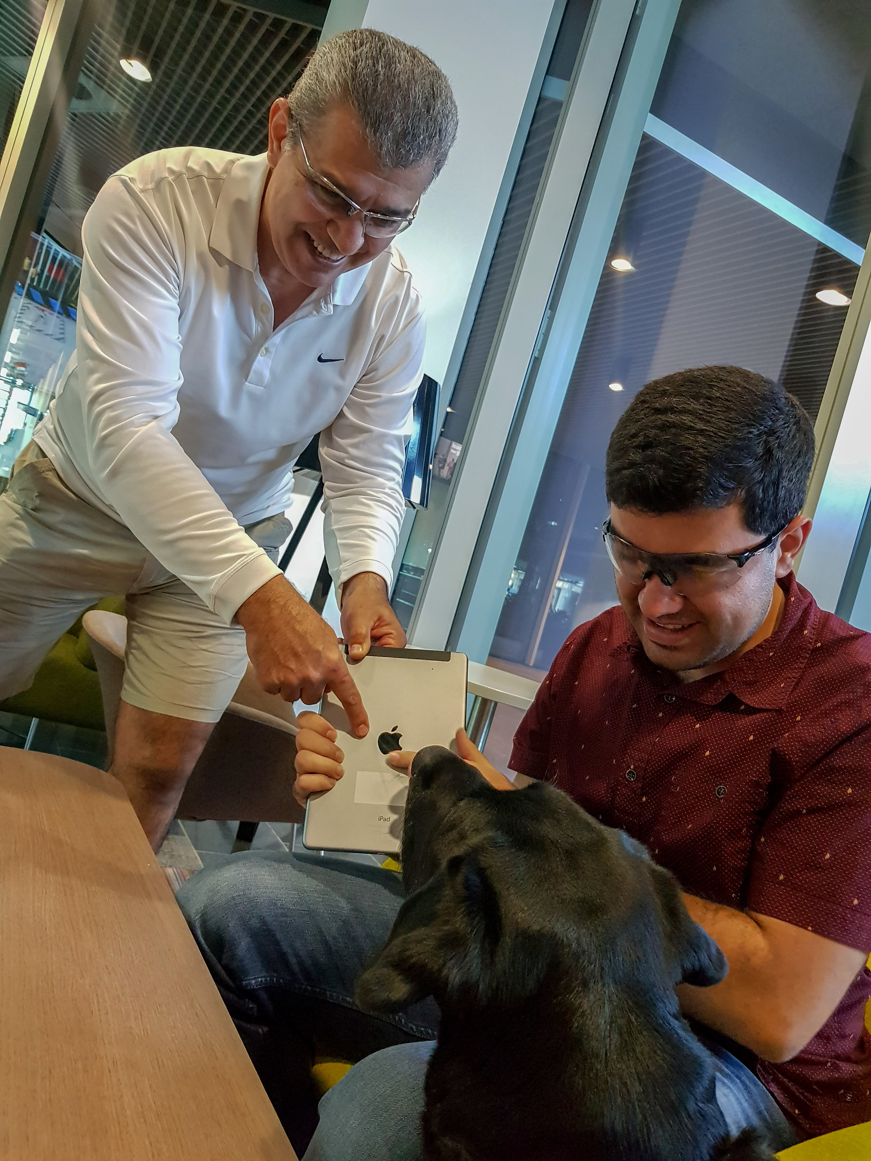 Cesar Velasquez with Santiago Velasquez and his guide dog, Lockie.